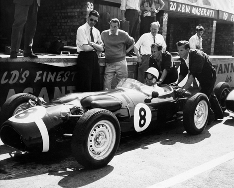 British Formula One driver Stirling Moss takes a green Ferguson car out for practice laps at Silverstone Circuit on July 6, 1961. Credit: AP Photo